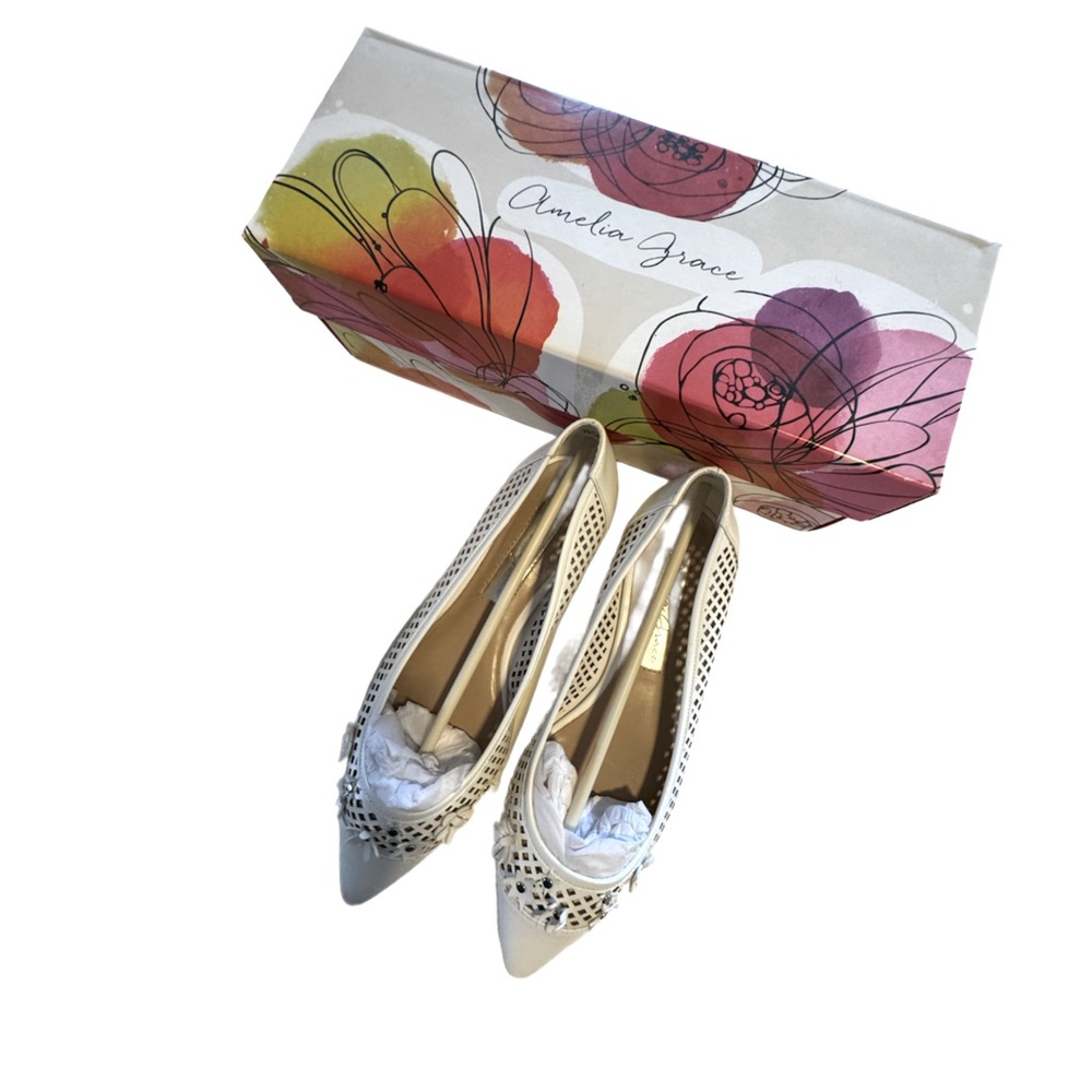 Amelia Grace ladies flat spring shoe in white with toe cut out and 3d flowers.